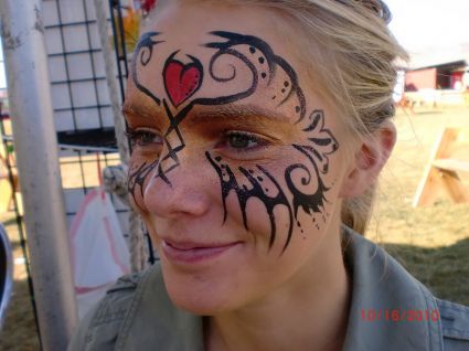 Tribal Mask Tattoo On Face